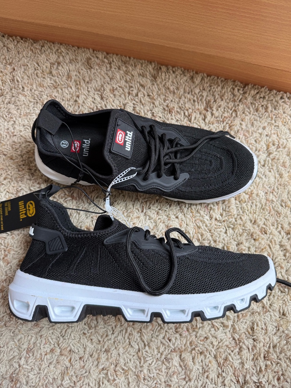 Ecko Unltd. men’s mesh sneakers featuring a black and white size 9.5